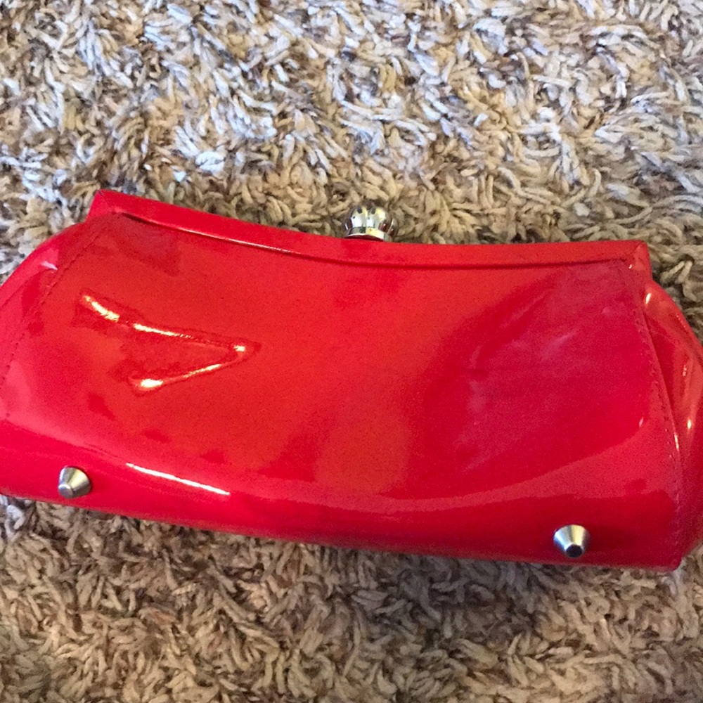Red patent leather clutch
